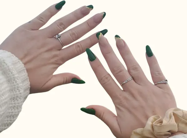 Long almond nails in deep green on both hands