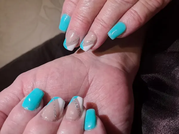 Turquoise nails with a nude accent nail
